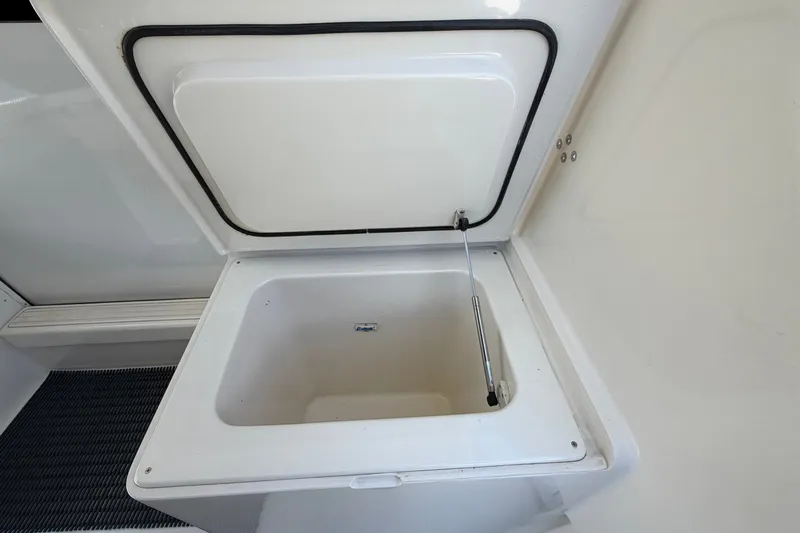Slide: The Image of Open storage compartment on a 2007 Post 50 Convertible boat. - 15