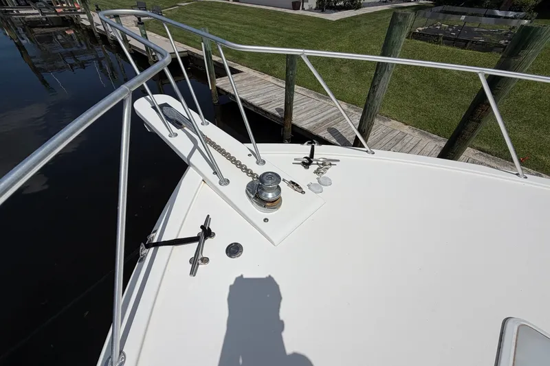 Slide: The Image of Bow of a 2007 Post 50 Convertible boat with anchor chain and railing. - 10