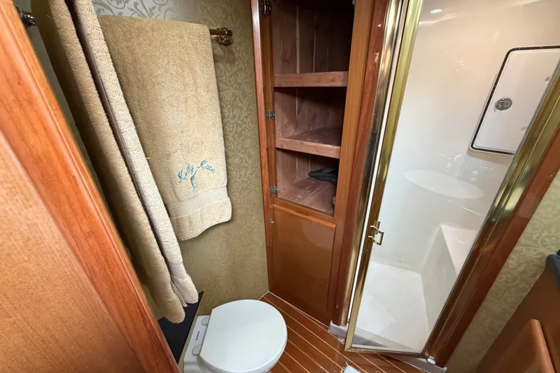 Slide: The Image of Luxurious bathroom in 2007 Post 50 Convertible yacht with wooden cabinetry and shower. - 83