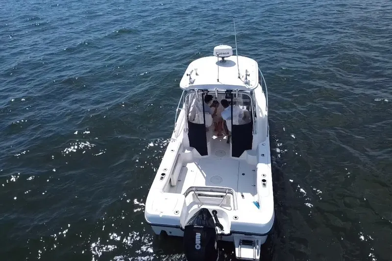 Slide: The Image of Aerial view of a 2005 Boston Whaler 235 Conquest boat on open water. - 9