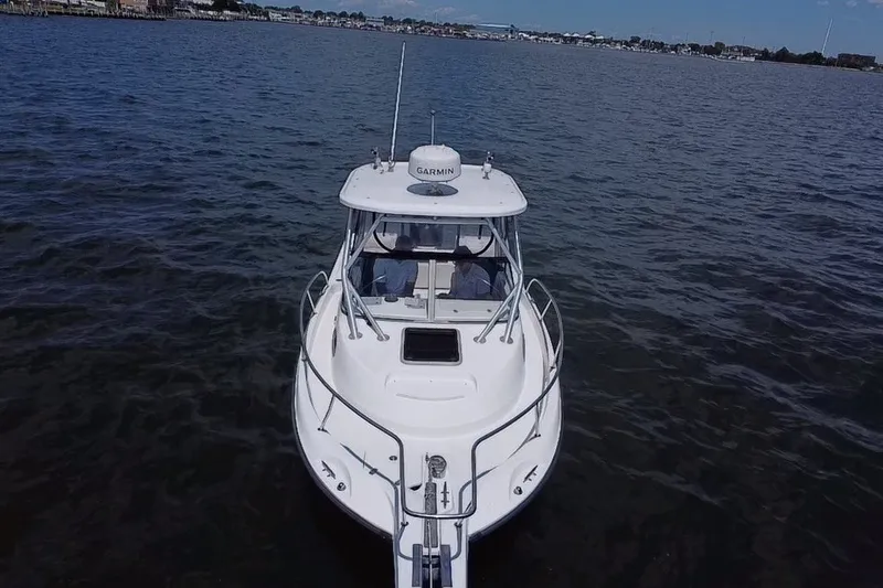 Slide: The Image of 2005 Boston Whaler 235 Conquest boat on open water, aerial view. - 8
