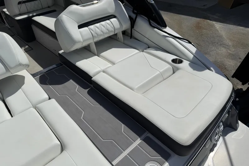 Slide: The Image of Luxurious seating area on a 2021 Regal LS6 boat with sleek design and cup holder. - 10