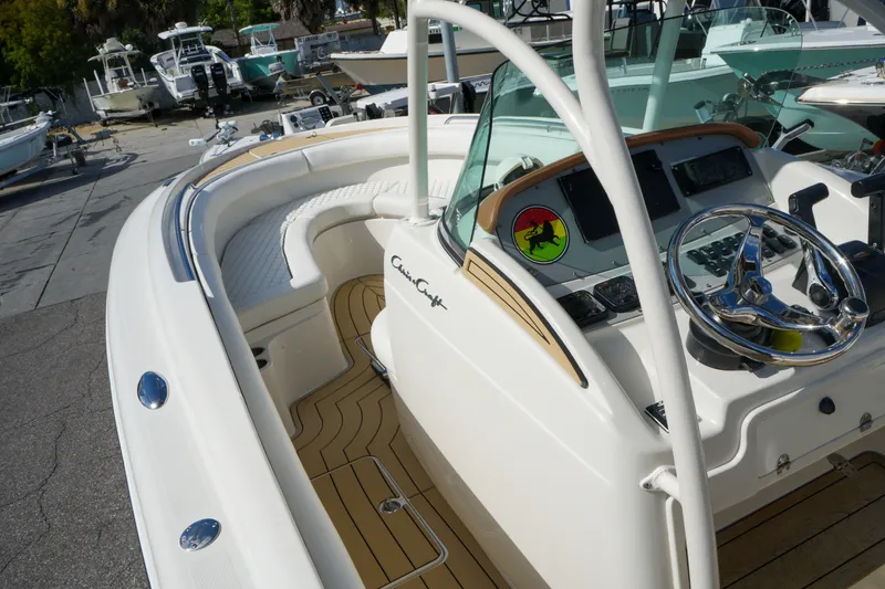 Slide: The Image of 2008 Chris-Craft Catalina 26 boat with sleek design and polished steering wheel. - 31