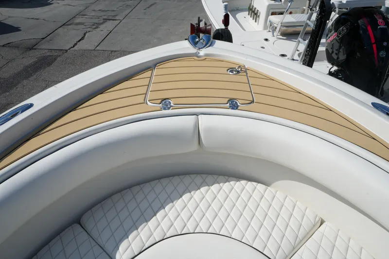 Slide: The Image of 2008 Chris-Craft Catalina 26 boat with white quilted seating and teak deck. - 21