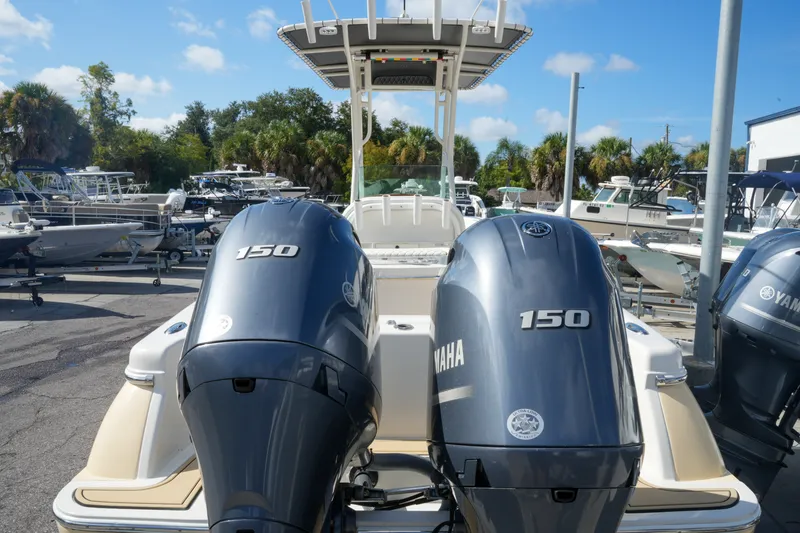 Slide: The Image of 2008 Chris-Craft Catalina 26 with twin Yamaha 150 engines, docked in a marina. - 7