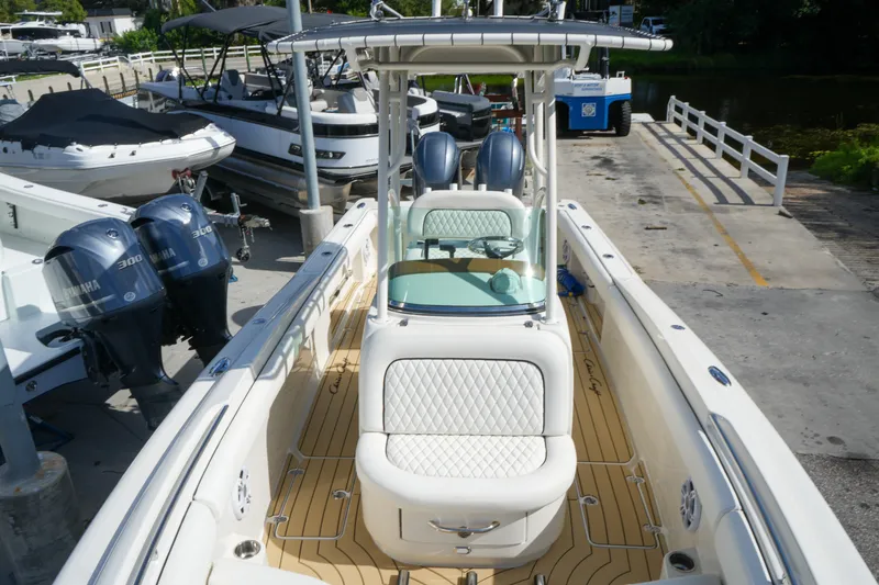 Slide: The Image of 2008 Chris-Craft Catalina 26 boat with dual Yamaha engines, docked at marina. - 23