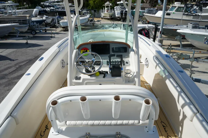 Slide: The Image of 2008 Chris-Craft Catalina 26 boat interior with steering wheel and control panel. - 13
