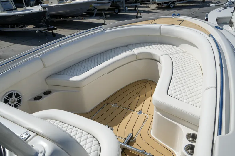 Slide: The Image of Luxurious interior of 2008 Chris-Craft Catalina 26 boat with white quilted seating. - 20