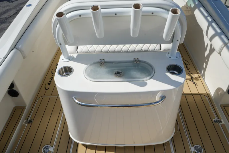 Slide: The Image of 2008 Chris-Craft Catalina 26 boat deck with rod holders and sink. - 12