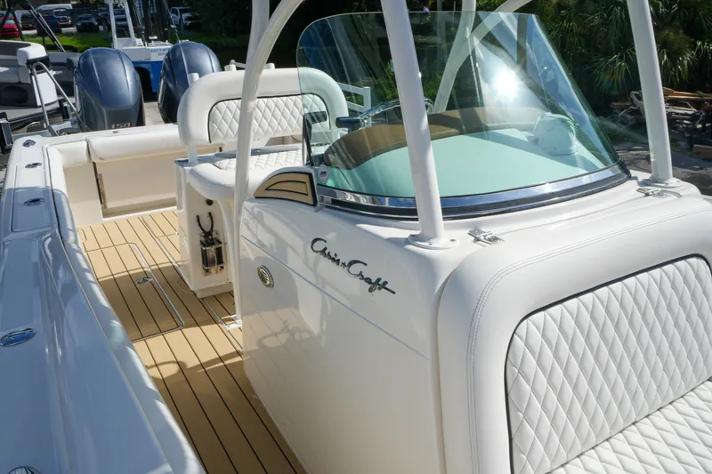 Slide: The Image of 2008 Chris-Craft Catalina 26 boat with elegant white seating and sleek design. - 27