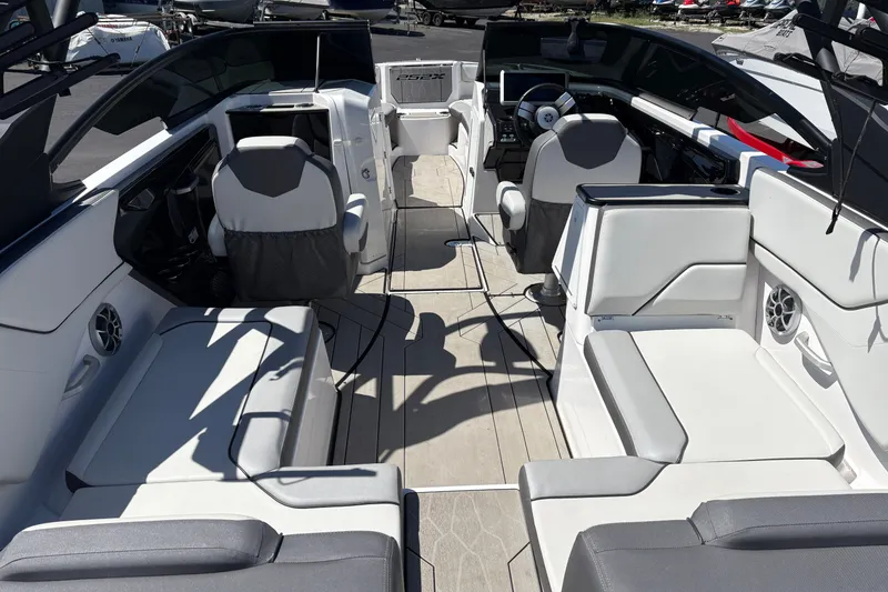 Slide: The Image of 2022 Yamaha Boats 252XE interior with modern seating and sleek design. - 4