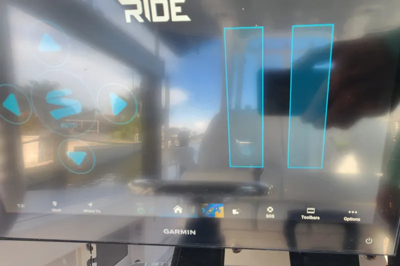 Slide: The Image of Garmin display on 2025 Sportsman Open 322 Center Console boat, showing navigation interface. - 7