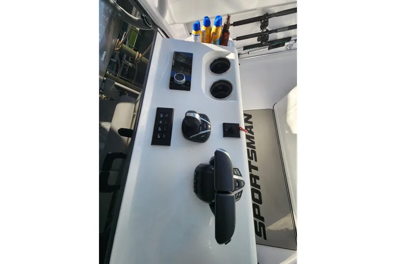 Slide: The Image of 2025 Sportsman Open 322 Center Console dashboard with controls and cup holders. - 8
