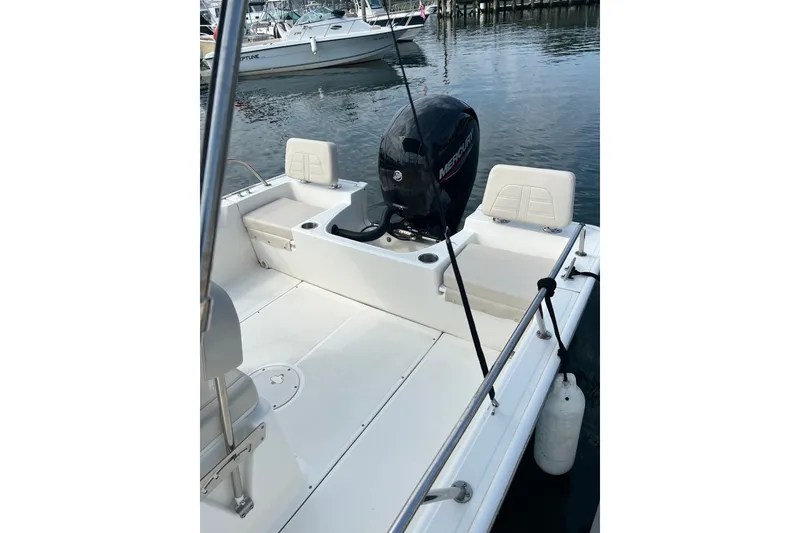 Slide: The Image of 2021 Boston Whaler 190 Montauk boat with Mercury engine, docked at marina. - 8