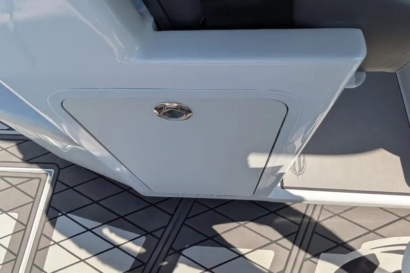 Slide: The Image of 2022 Encore Boat Works 28 interior detail with sleek storage compartment and modern flooring. - 18