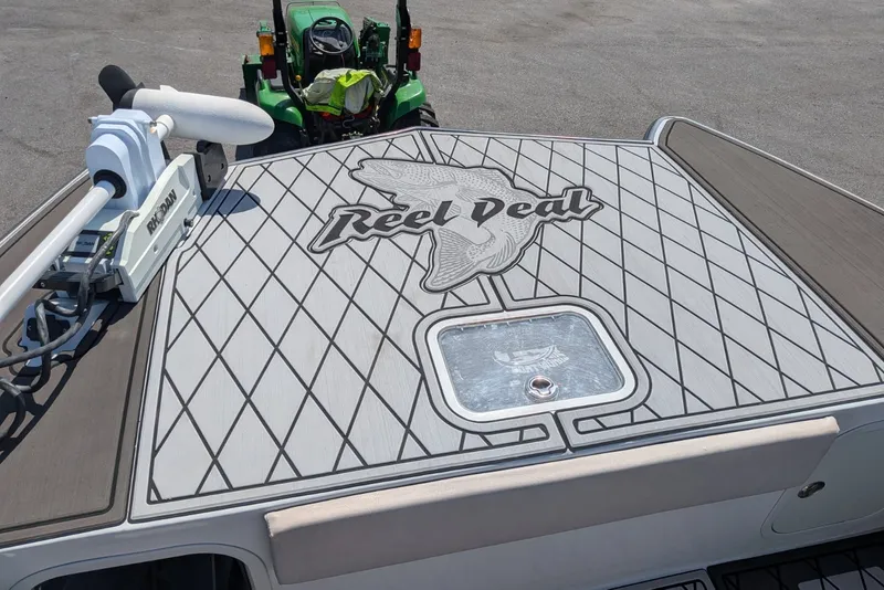 Slide: The Image of 2022 Encore Boat Works 28 deck with "Reel Deal" design and Rhodan trolling motor. - 11