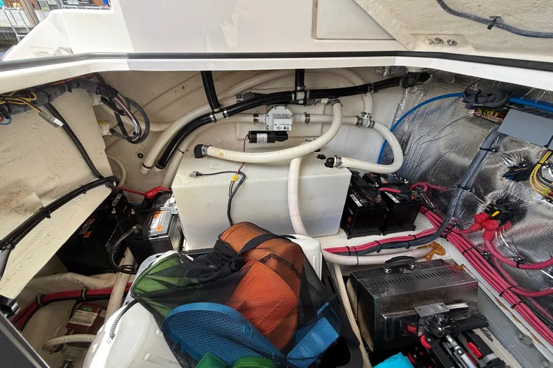 Slide: The Image of Engine compartment of a 2019 Regal 33 XO boat, showcasing wiring and components. - 36