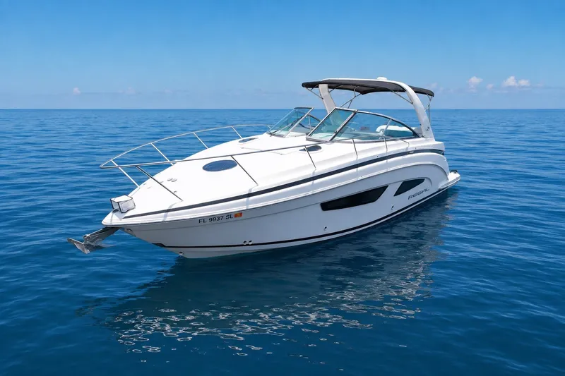 Slide: The Image of 2019 Regal 33 XO boat on calm blue ocean under clear sky. - 1
