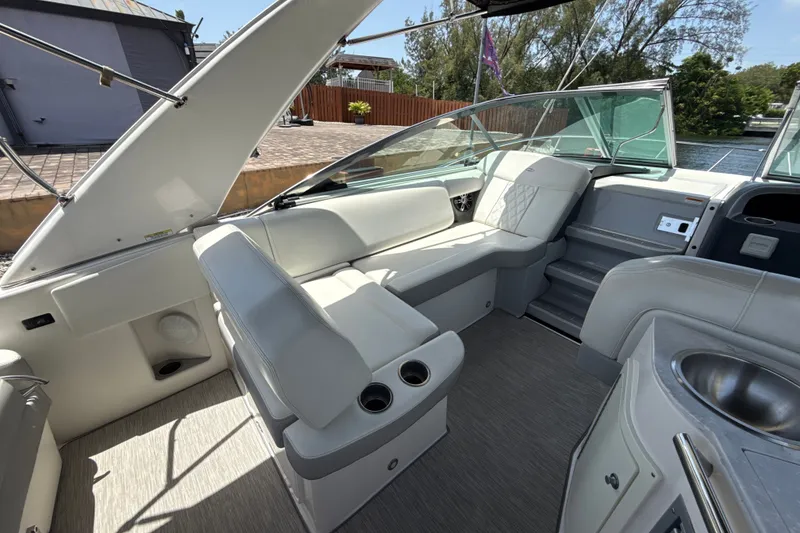 Slide: The Image of 2019 Regal 33 XO boat interior with white seating and modern amenities. - 8