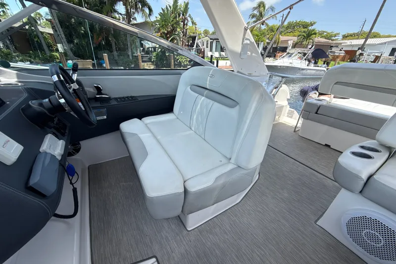 Slide: The Image of 2019 Regal 33 XO boat interior with plush seating and modern helm. - 15