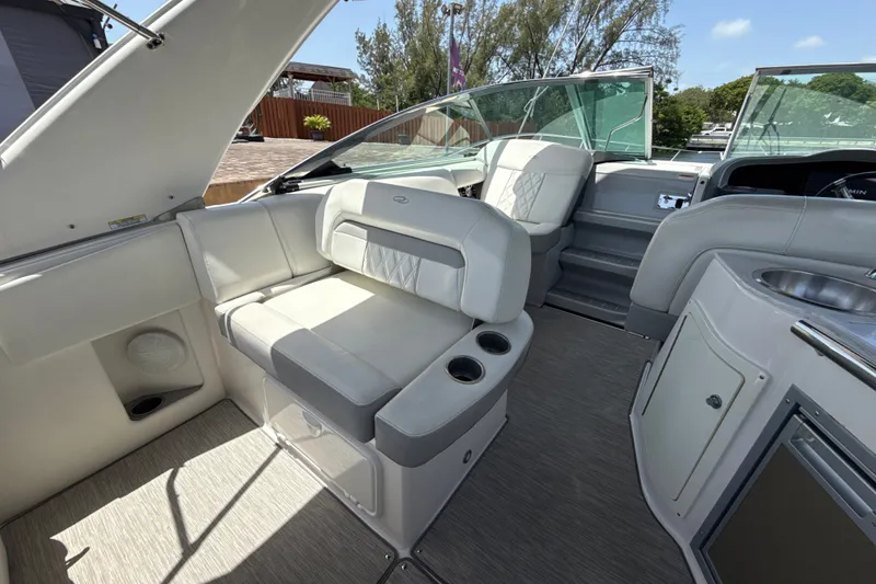 Slide: The Image of Interior of a 2019 Regal 33 XO boat with luxurious seating and modern amenities. - 9