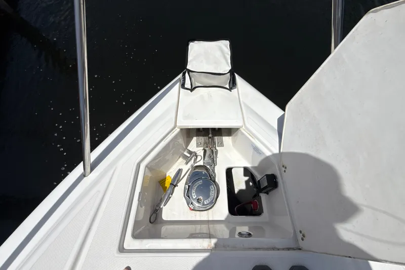 Slide: The Image of 2019 Regal 33 XO boat anchor compartment with equipment and storage. - 32
