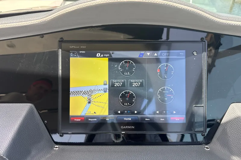 Slide: The Image of Garmin GPS display on 2019 Regal 33 XO boat dashboard showing navigation and engine data. - 19
