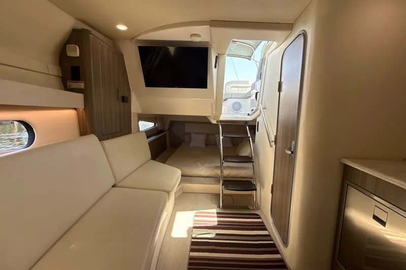 Slide: The Image of Luxurious interior of a 2019 Regal 33 XO yacht with modern seating and elegant design. - 27