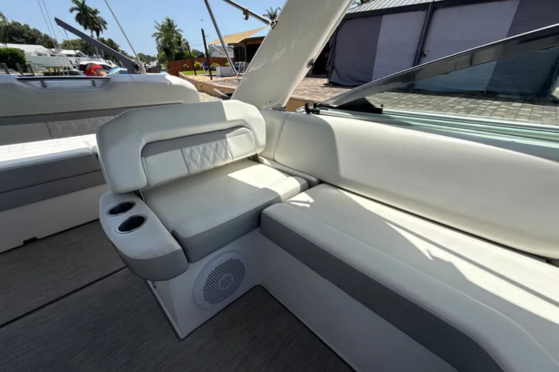 Slide: The Image of Interior seating of 2019 Regal 33 XO boat with cup holders and speaker. - 13