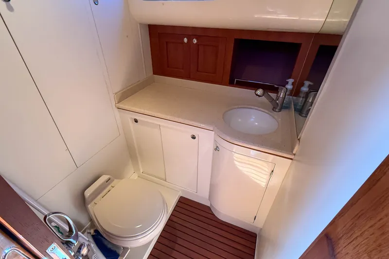 Slide: The Image of Luxurious 2008 Grand Banks 45 Eastbay SX yacht bathroom with modern fixtures and wooden cabinetry. - 42