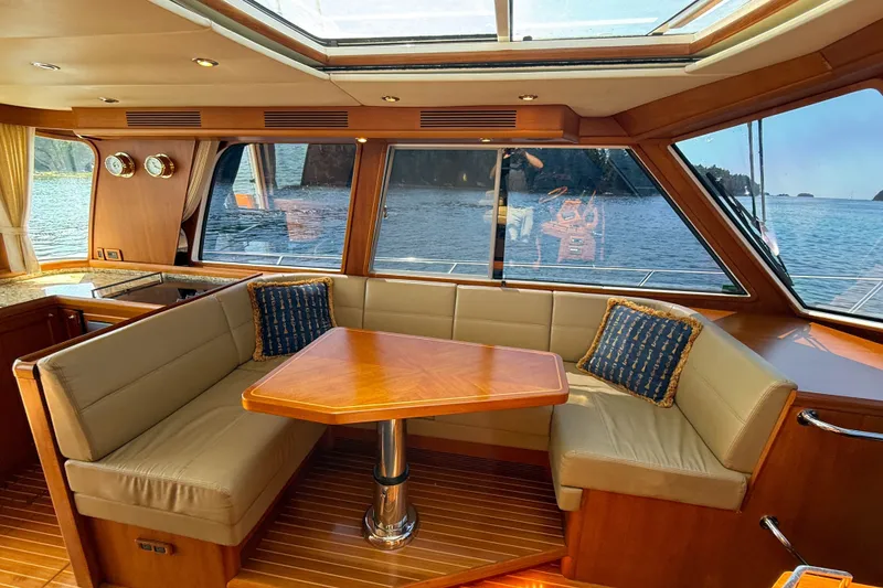 Slide: The Image of Luxurious 2008 Grand Banks 45 Eastbay SX yacht interior with elegant seating and ocean view. - 19