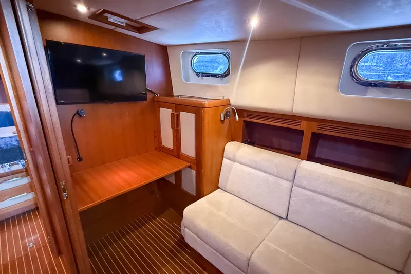 Slide: The Image of Luxurious interior of 2008 Grand Banks 45 Eastbay SX yacht with cozy seating and TV. - 40