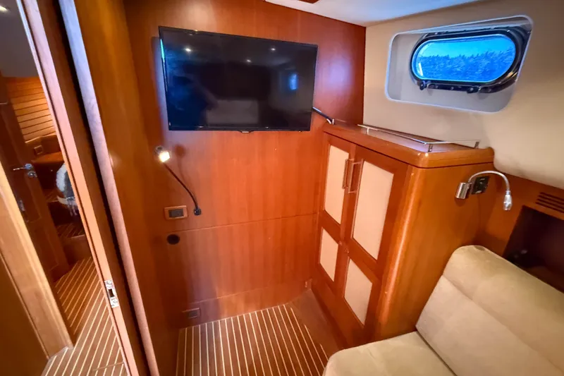Slide: The Image of Interior of 2008 Grand Banks 45 Eastbay SX yacht with TV and wooden cabinetry. - 39