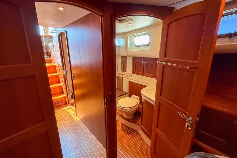 Slide: The Image of Luxurious 2008 Grand Banks 45 Eastbay SX yacht interior with wooden finishes and modern amenities. - 34