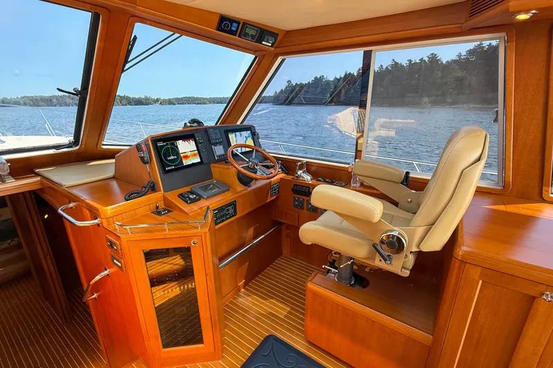 Slide: The Image of 2008 Grand Banks 45 Eastbay SX helm with luxurious wood finish and modern navigation equipment. - 23