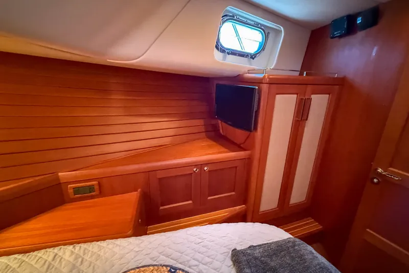 Slide: The Image of Luxurious wooden interior of 2008 Grand Banks 45 Eastbay SX yacht cabin. - 33