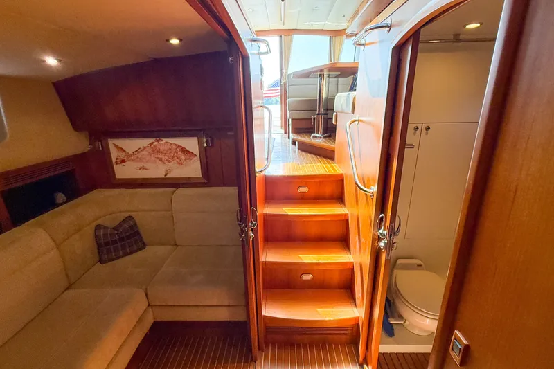Slide: The Image of Luxurious interior of 2008 Grand Banks 45 Eastbay SX yacht with cozy seating and wooden stairs. - 41