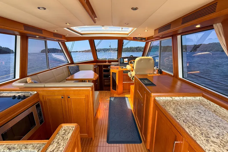 Slide: The Image of Luxurious 2008 Grand Banks 45 Eastbay SX yacht interior with panoramic windows and elegant wood finishes. - 13