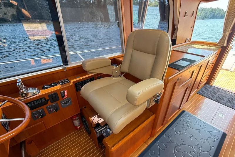 Slide: The Image of Interior of 2008 Grand Banks 45 Eastbay SX yacht with helm seat and control panel. - 25