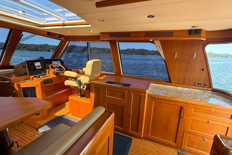 Slide: The Image of Luxurious 2008 Grand Banks 45 Eastbay SX yacht interior with wood finish and scenic water view. - 20