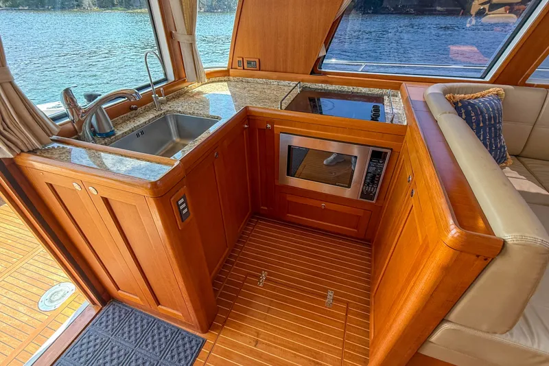 Slide: The Image of Luxurious 2008 Grand Banks 45 Eastbay SX yacht interior with modern kitchen amenities. - 15