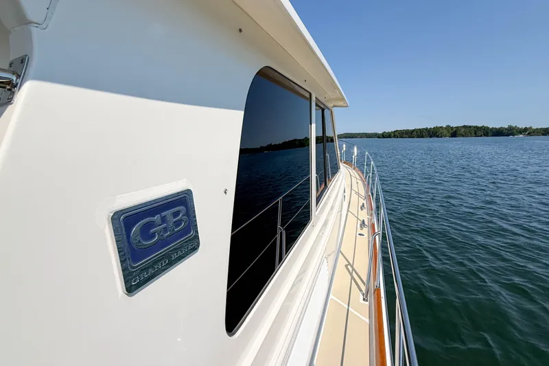 Slide: The Image of 2008 Grand Banks 45 Eastbay SX yacht cruising on a serene lake. - 47