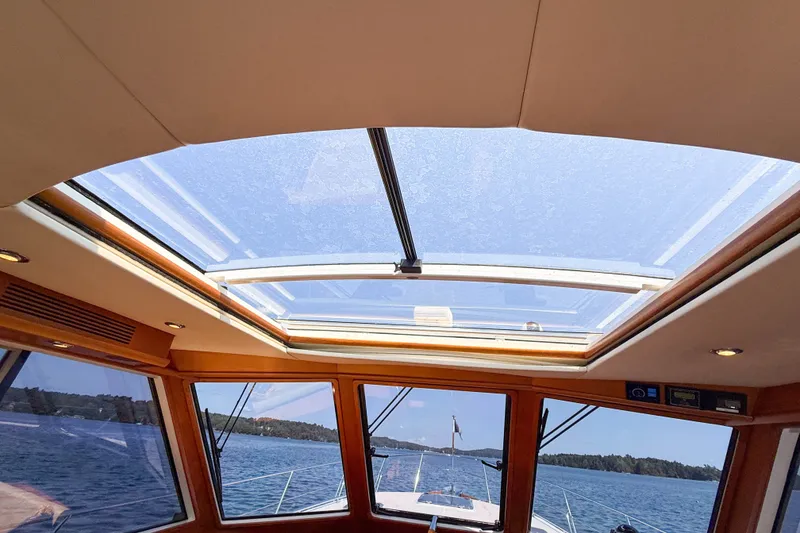 Slide: The Image of Interior view of 2008 Grand Banks 45 Eastbay SX yacht with skylight and scenic water backdrop. - 30