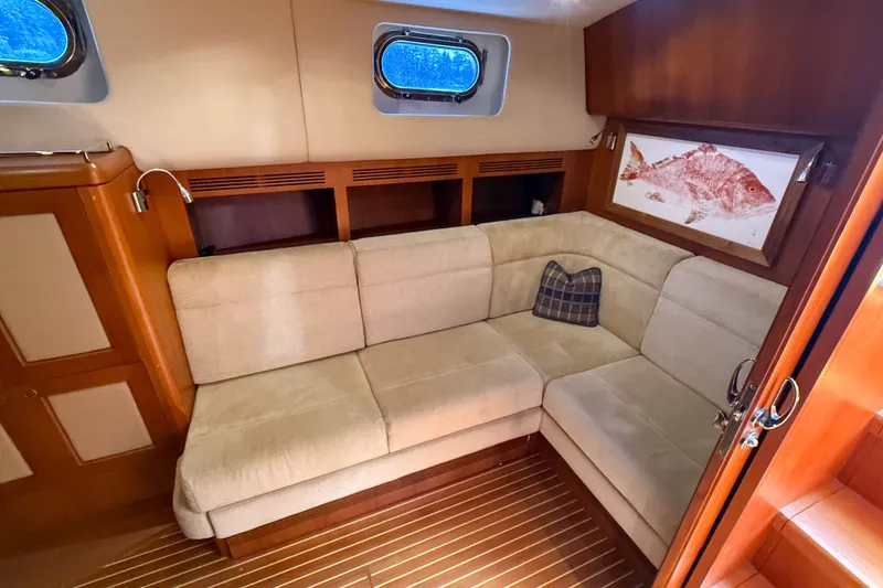 Slide: The Image of Luxurious interior of 2008 Grand Banks 45 Eastbay SX with beige sofa and nautical decor. - 37