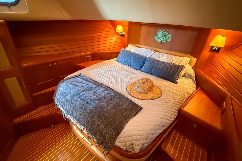 Slide: The Image of Luxurious cabin interior of 2008 Grand Banks 45 Eastbay SX yacht with cozy bedding. - 32