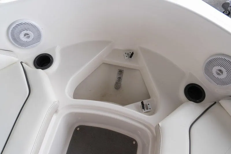 Slide: The Image of Interior of 2015 Yamaha AR190 boat, featuring seating and speaker system. - 14