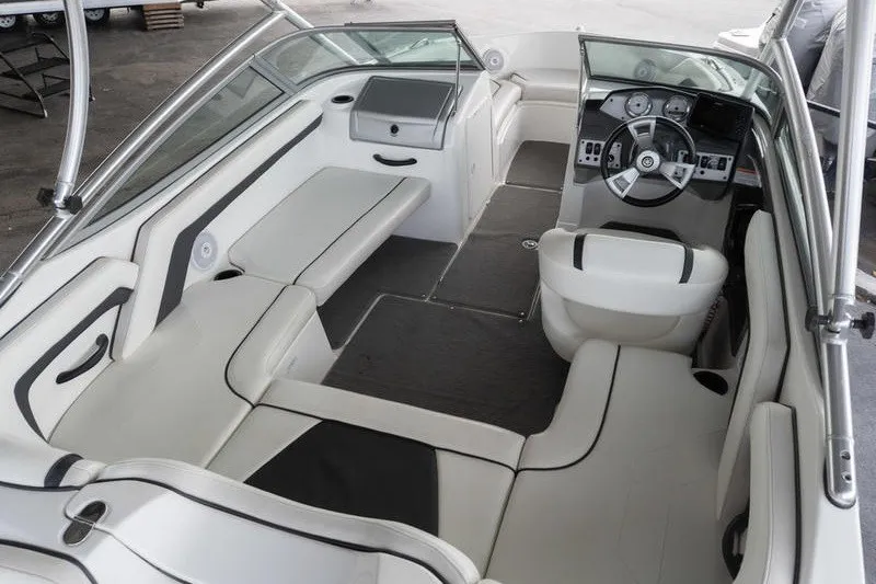 Slide: The Image of 2015 Yamaha Boats AR190 interior with sleek seating and modern dashboard design. - 5