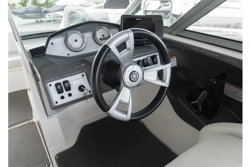 Slide: The Image of 2015 Yamaha Boats AR190 dashboard with steering wheel and control panel. - 6