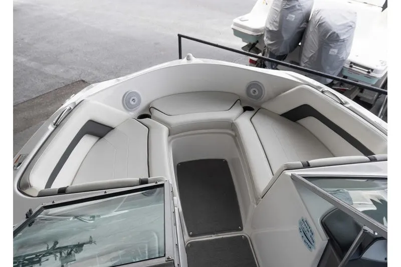 Slide: The Image of 2015 Yamaha Boats AR190 interior with cushioned seating and sleek design. - 12