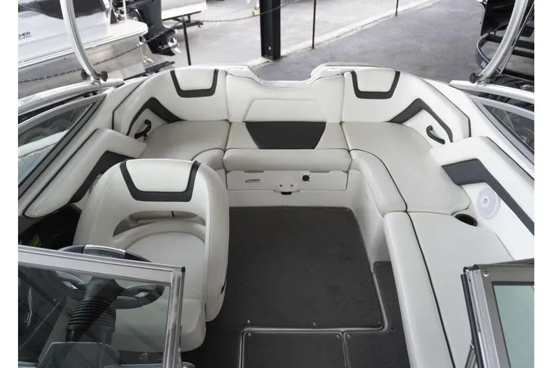 Slide: The Image of 2015 Yamaha Boats AR190 interior with white seating and modern design. - 16